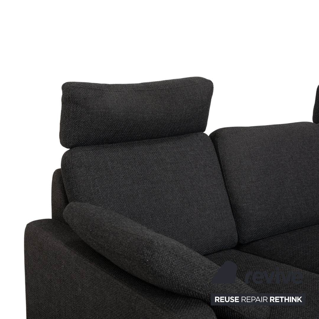 Canapé d'angle COR Conseta en tissu gris foncé avec pouf
