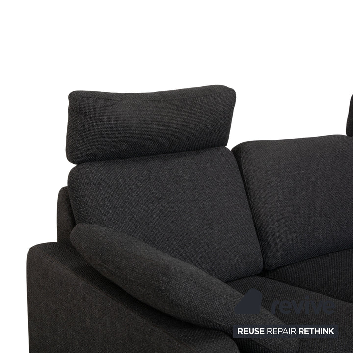 Canapé d'angle COR Conseta en tissu gris foncé avec pouf