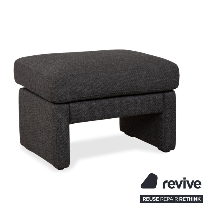 Canapé d'angle COR Conseta en tissu gris foncé avec pouf