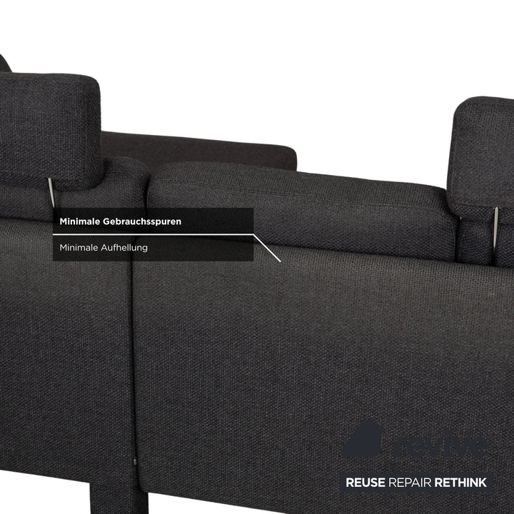 Canapé d'angle COR Conseta en tissu gris foncé avec pouf