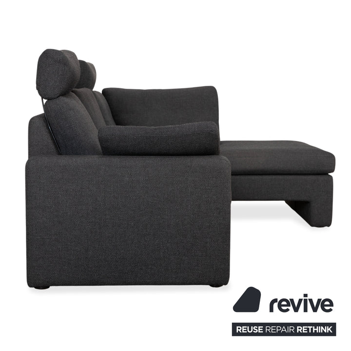 Canapé d'angle COR Conseta en tissu gris foncé avec pouf
