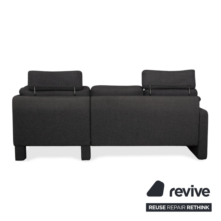 Canapé d'angle COR Conseta en tissu gris foncé avec pouf