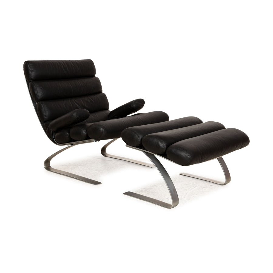 Fauteuil en cuir Cor Sinus noir avec tabouret