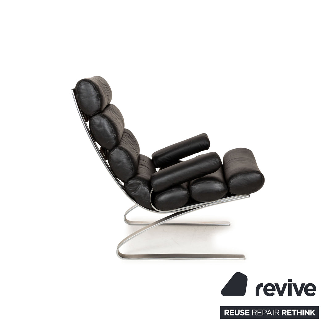 Fauteuil en cuir Cor Sinus noir avec tabouret