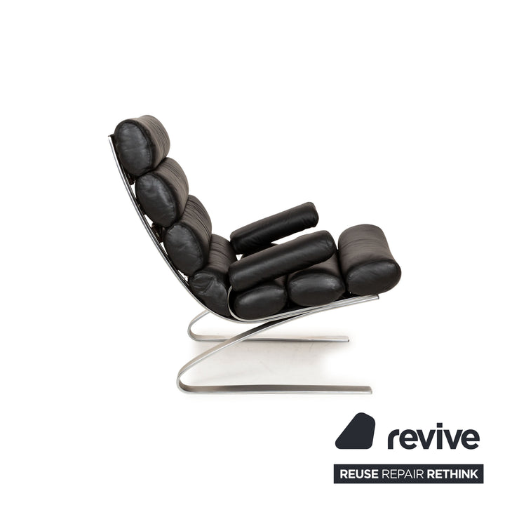 Fauteuil en cuir Cor Sinus noir avec tabouret