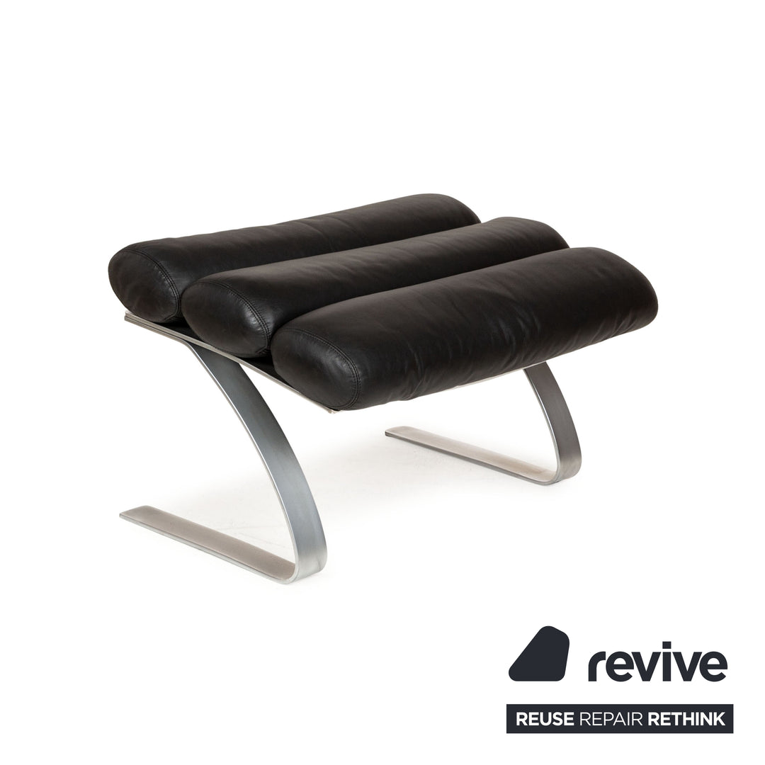 Fauteuil en cuir Cor Sinus noir avec tabouret