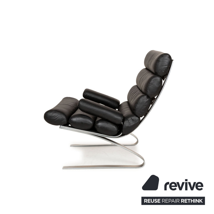 Fauteuil en cuir Cor Sinus noir avec tabouret