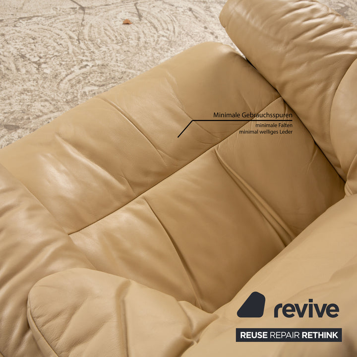 Fauteuil en cuir Stressless Reno beige avec tabouret