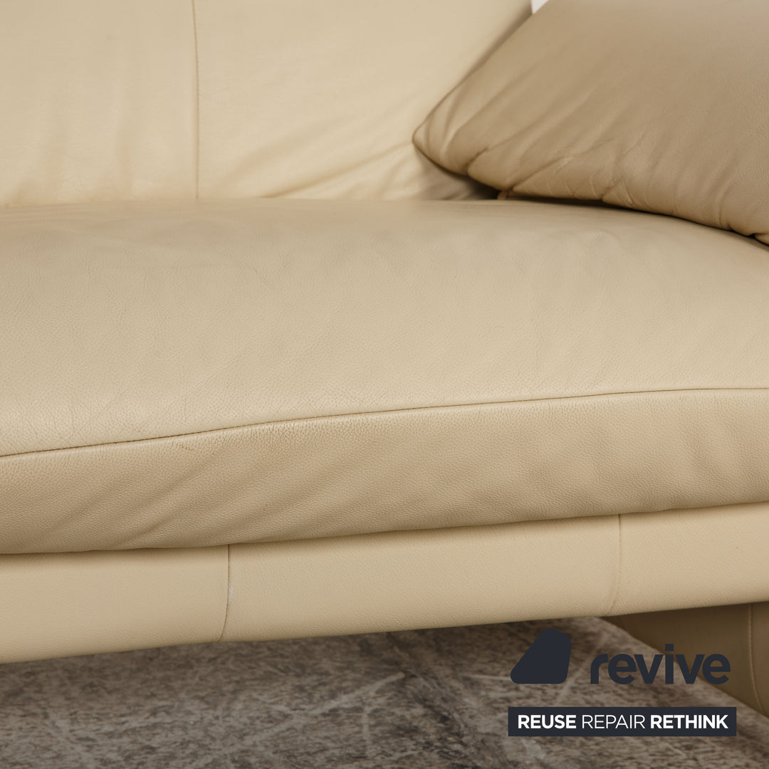 Laaus leather two-seater cream sofa couch