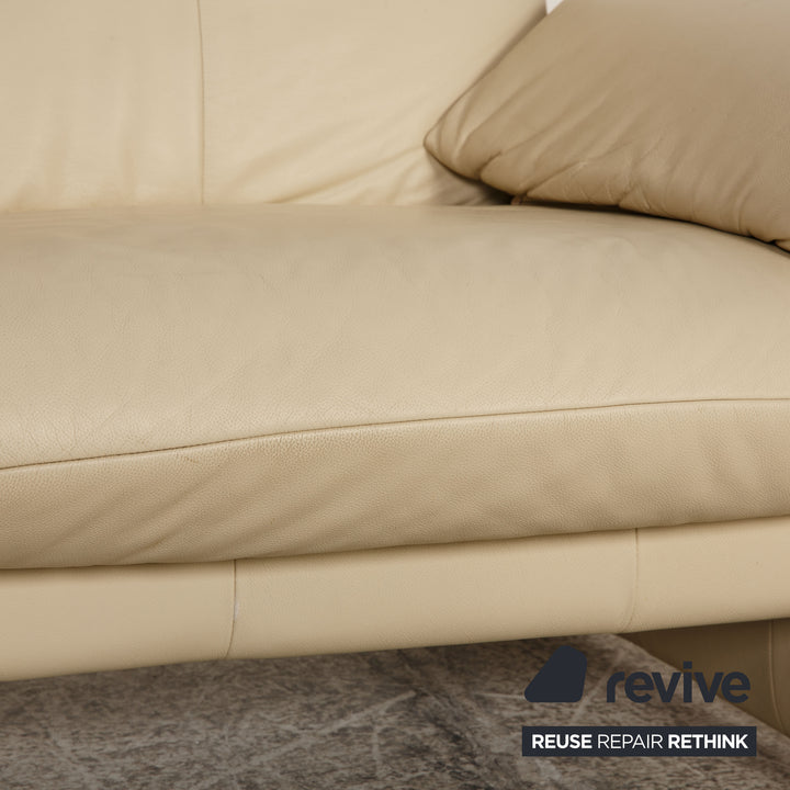 Laaus leather two-seater cream sofa couch